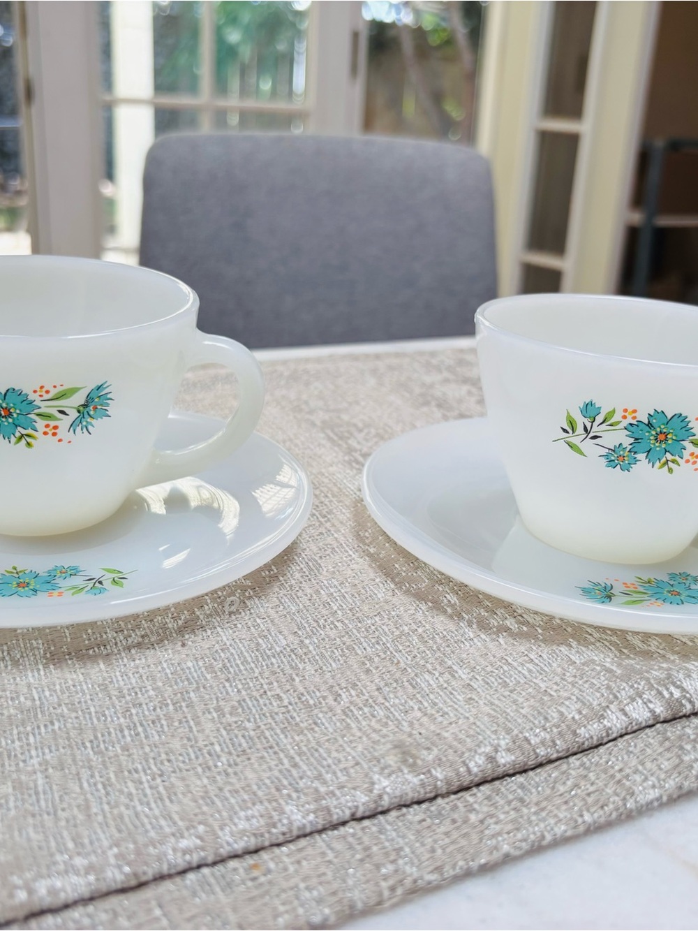 Vintage Fire King Milk Glass Teacup and Saucer Set with Turquoise Floral Accent